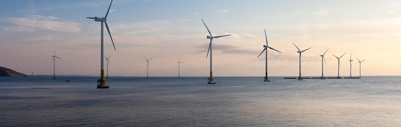 Row of offshore wind turbines in the sea